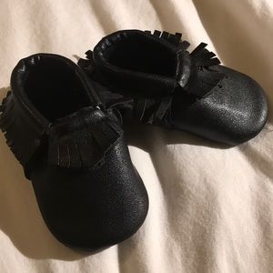 Black faux leather moccasins